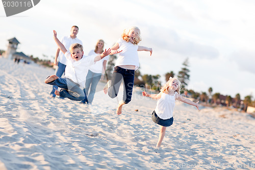 Image of Happy Sibling Children Jumping for Joy