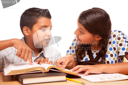 Image of Hispanic Brother and Sister Having Fun Studying