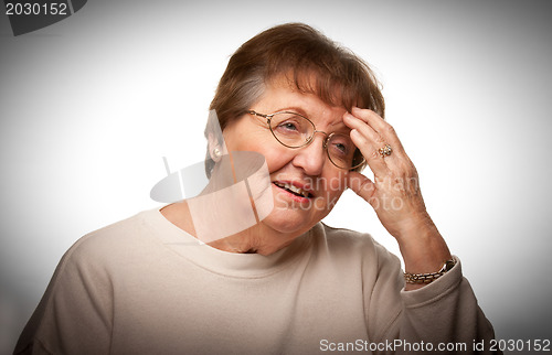 Image of Senior Woman with Aching Head