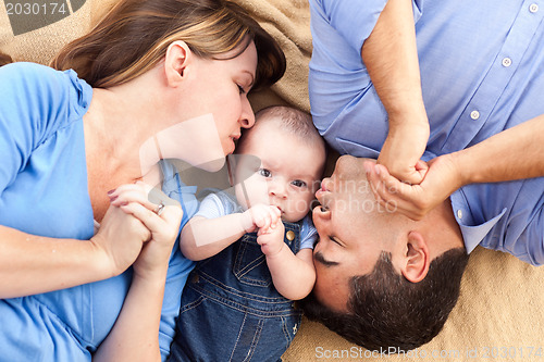 Image of Mixed Race Family with Baby Playing on the Blanket