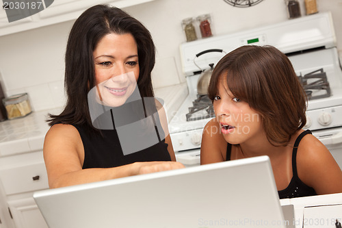 Image of Hispanic Mother and Mixed Race Daughter on the Laptop