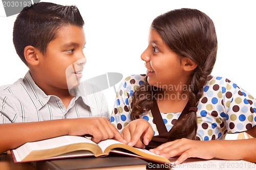 Image of Hispanic Brother and Sister Having Fun Studying