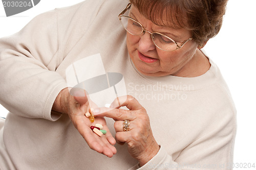 Image of Attractive Senior Woman and Medication Pills
