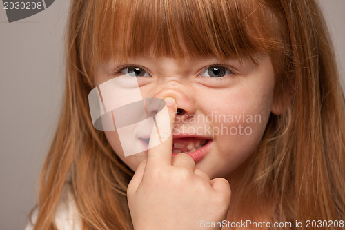 Image of Fun Portrait of an Adorable Red Haired Girl on Grey