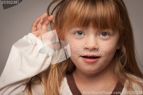 Image of Fun Portrait of an Adorable Red Haired Girl on Grey