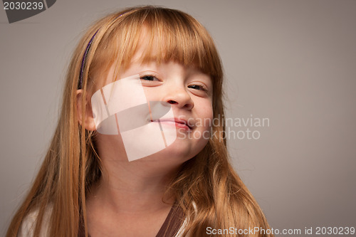 Image of Fun Portrait of an Adorable Red Haired Girl on Grey