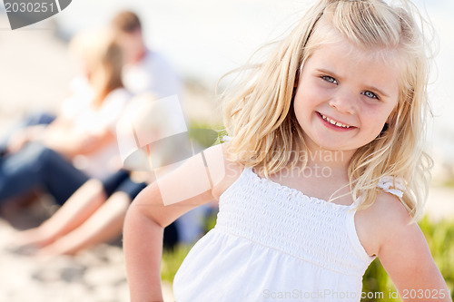 Image of Adorable Little Blonde Girl Having Fun At the Beach