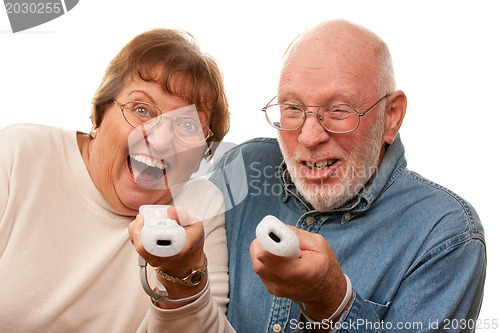 Image of Happy Senior Couple Play Video Game with Remotes