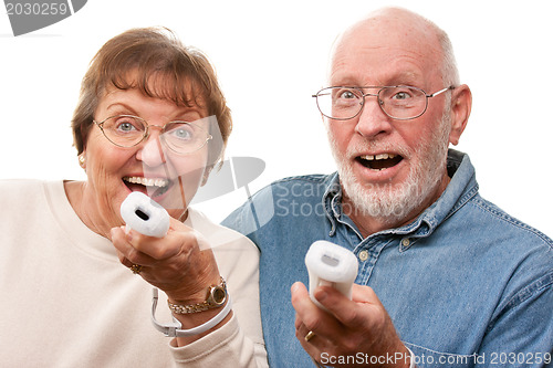 Image of Happy Senior Couple Play Video Game with Remotes