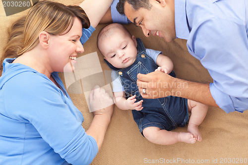 Image of Mixed Race Family Playing on the Blanket