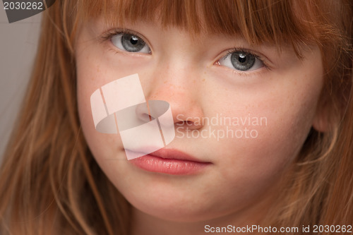 Image of Fun Portrait of an Adorable Red Haired Girl on Grey