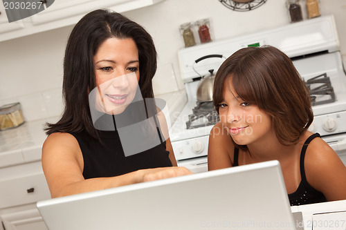 Image of Hispanic Mother and Mixed Race Daughter on the Laptop