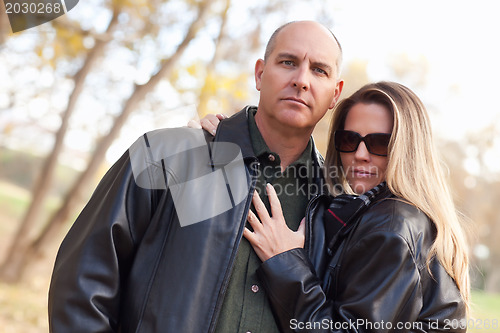 Image of Attractive Couple in Park with Leather Jackets