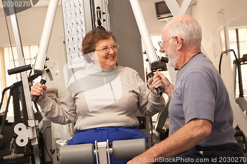 Image of Senior Adult Couple Working Out Together in the Gym