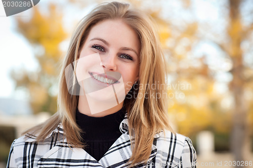 Image of Pretty Young Woman Smiling in the Park