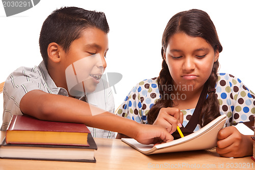 Image of Hispanic Brother and Sister Having Fun Studying