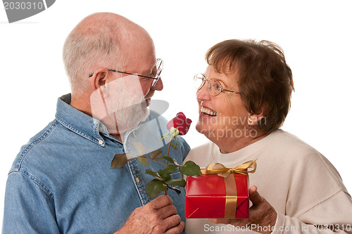 Image of Happy Senior Couple with Gift and Red Rose