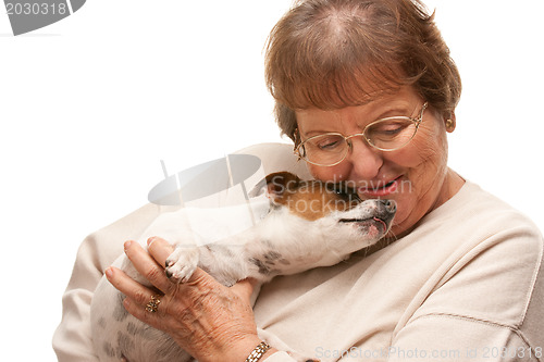 Image of Happy Attractive Senior Woman with Puppy on White