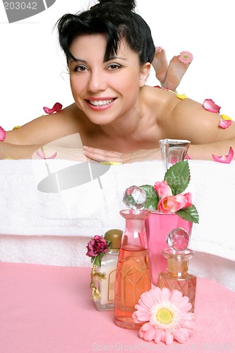 Image of Beautiful smiling woman relaxing at spa