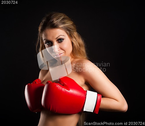 Image of beautiful nude girl with boxing gloves
