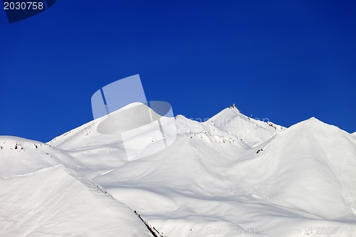 Image of Snow-white mountains and blue sky