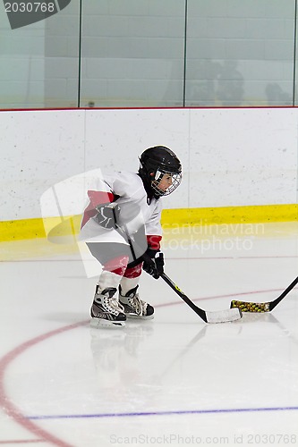 Image of Little boy playing ice hockey