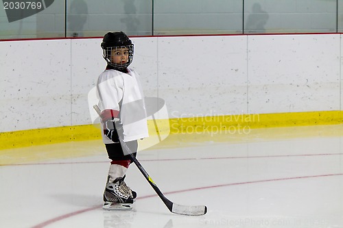 Image of Little boy playing ice hockey