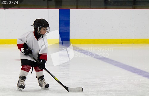 Image of Little boy playing ice hockey