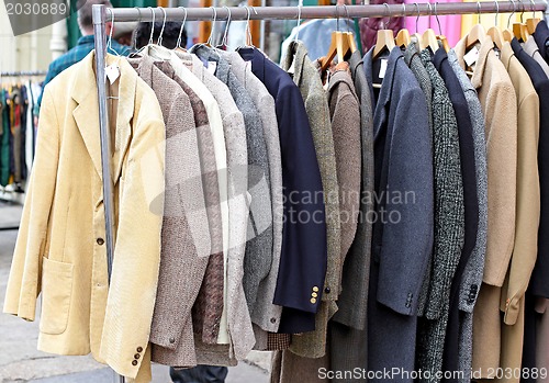 Image of Suits at rail