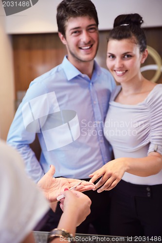 Image of happy young couple in jewelry store