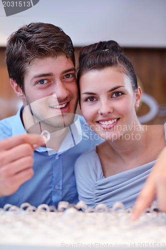 Image of happy young couple in jewelry store