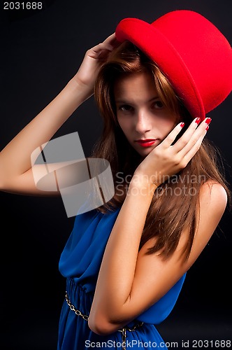 Image of beautiful woman with red hat