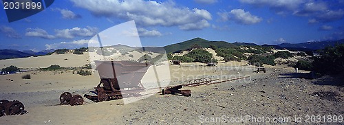 Image of old mine trolleys on the beach