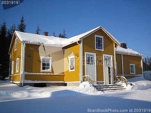 Image of yellow wooden house