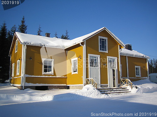 Image of yellow wooden house