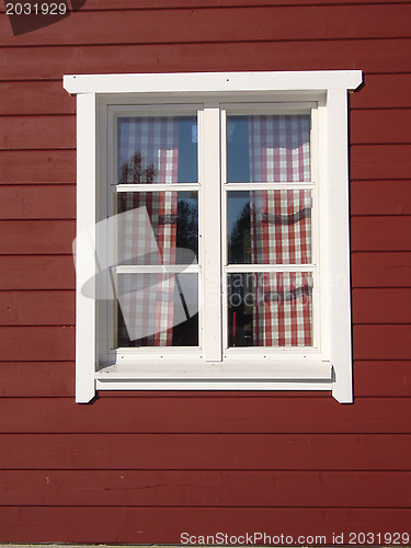 Image of white window on red house