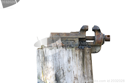 Image of old vise on a stump