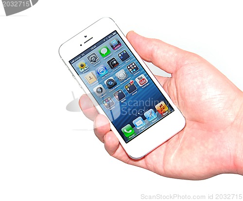 Image of Hand holding new iPhone 5