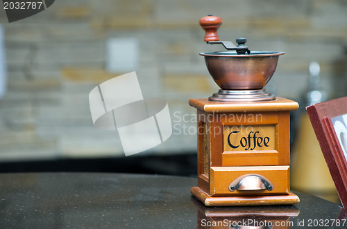 Image of grinder with a coffee beans