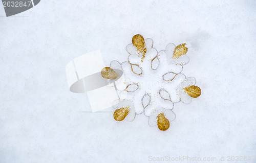 Image of Snowflake in snow