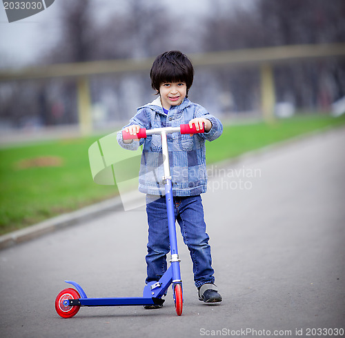 Image of boy with scooter