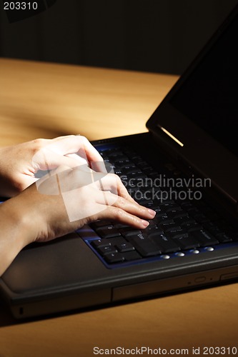 Image of Typing on laptop