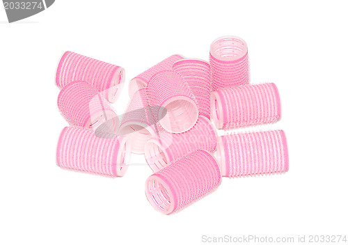 Image of Twelve pink velcro rollers in a jumbled pile