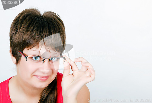 Image of beautiful blue eyed young smiling girl in glasses