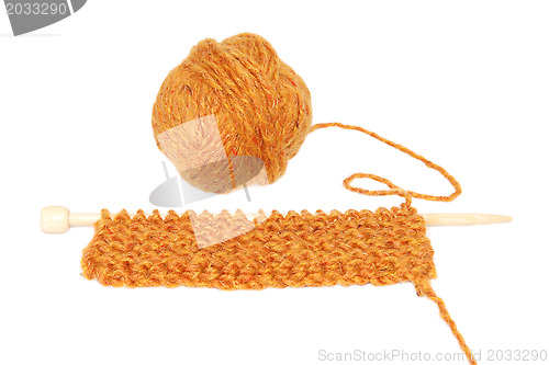 Image of Knitting in garter stitch on one needle with a ball of wool