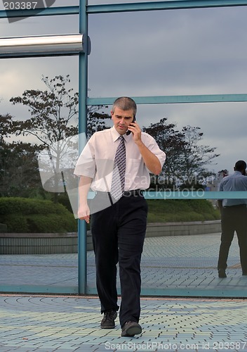 Image of Businessman using mobile phone