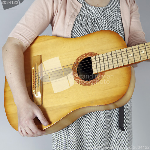 Image of Playing the guitar