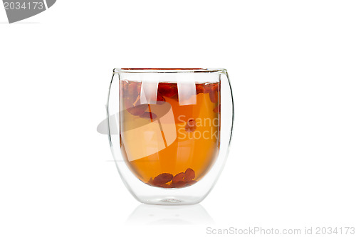 Image of Cup of delicious hot goji berry potion on white