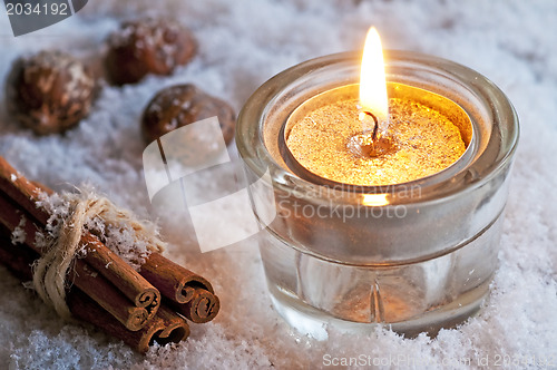 Image of candle in snow