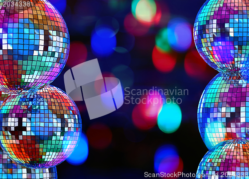Image of Colorful dark background with mirror disco balls